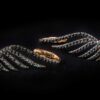 Wings along the ears covered with the black diamonds earrings