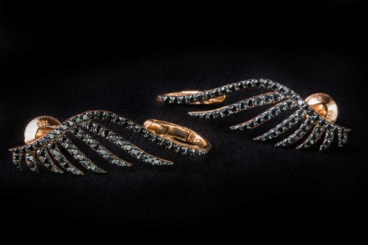 Wings along the ears covered with the black diamonds earrings