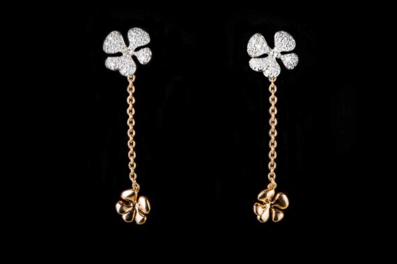 two flowers on the chain with diamond earrings